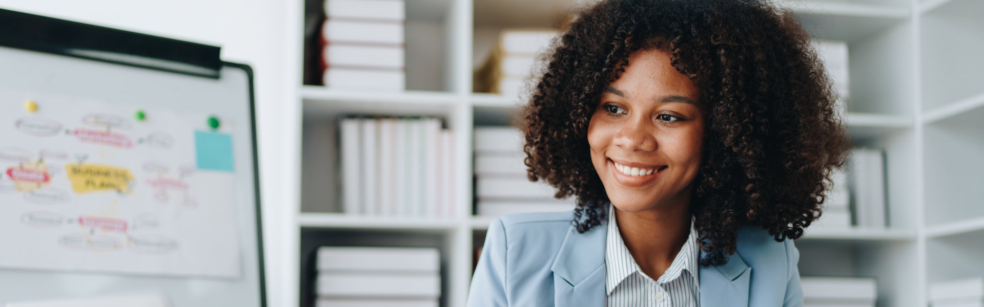 woman smiling while working